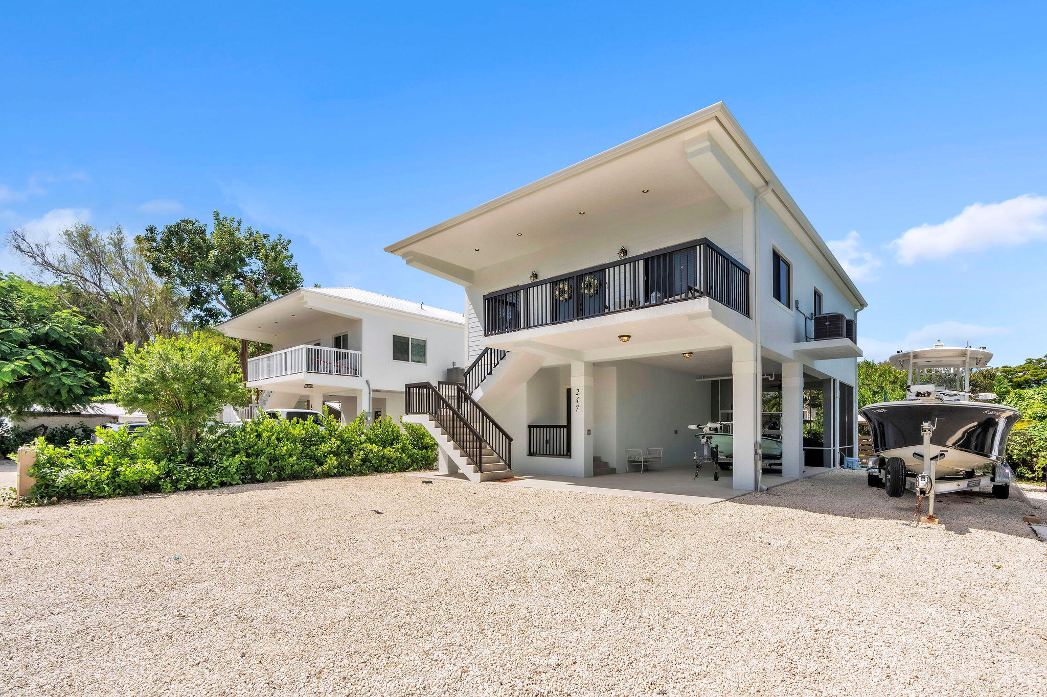 247 Hispanola Road Tavernier, FL 33070 - Photo 2 of 39 a front view of a house with a yard