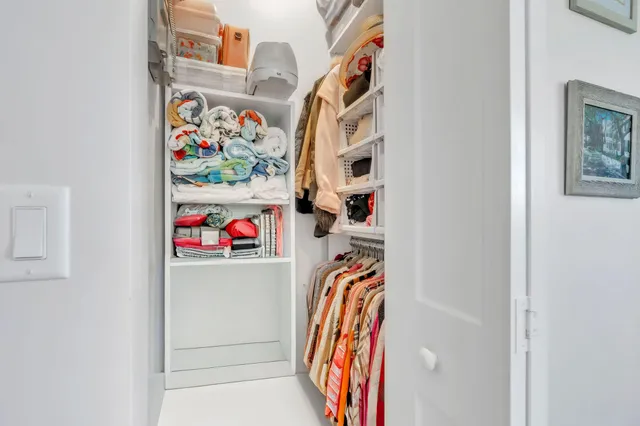 a bed room with a bed and a chandelier