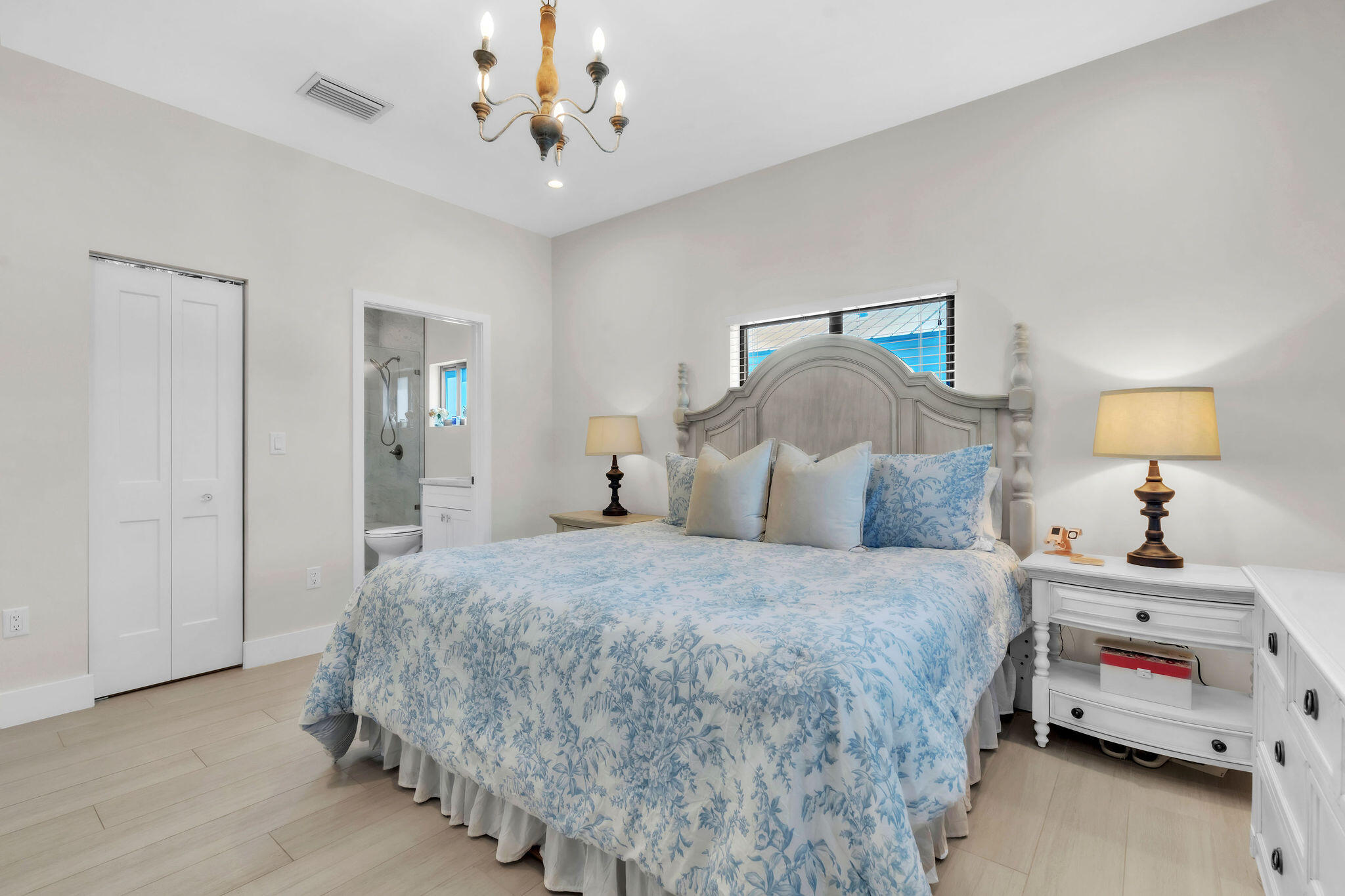247 Hispanola Road Tavernier, FL 33070 - Photo 23 of 39 a bedroom with a bed and a chandelier