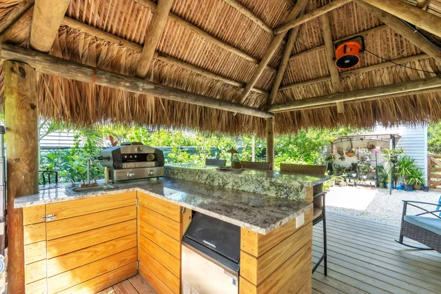 a view of an chair and tables in the patio