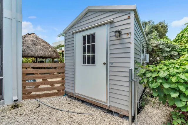 an aerial view of a house with a big yard