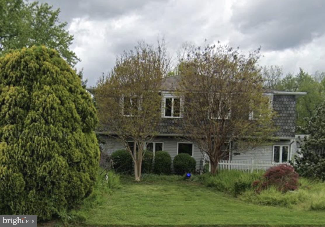 313 Trenton Road Fairless Hills, PA 19030 - Photo 2 of 13 a view of a brick house with a yard