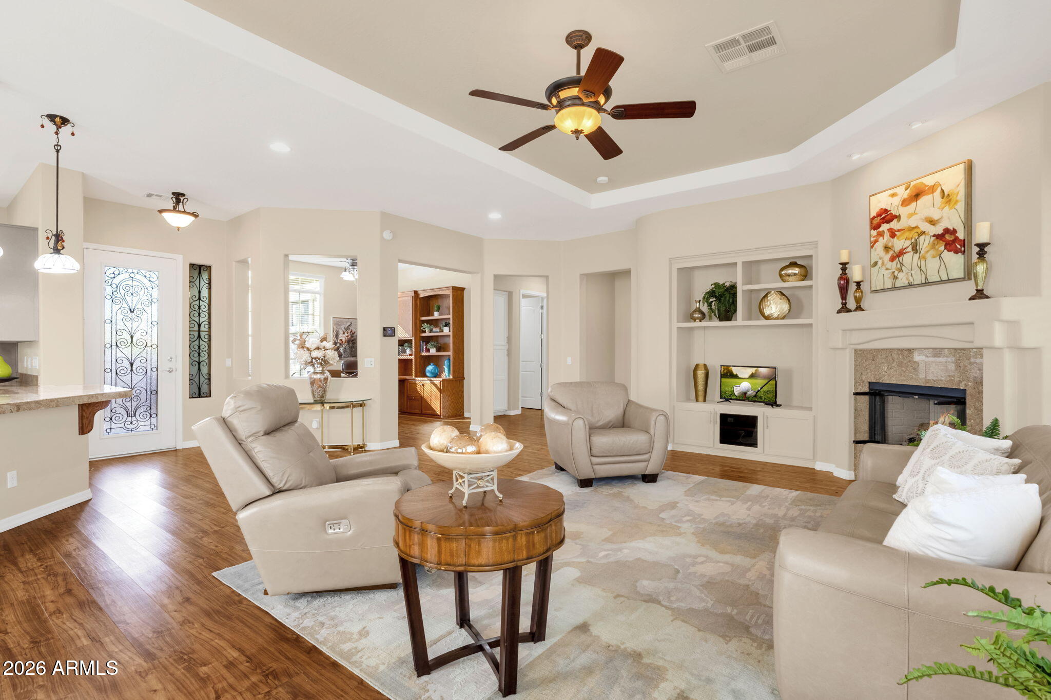 4734 East Indigo Street Gilbert, AZ 85298 - Photo 11 of 32 a living room with furniture kitchen view and a fireplace