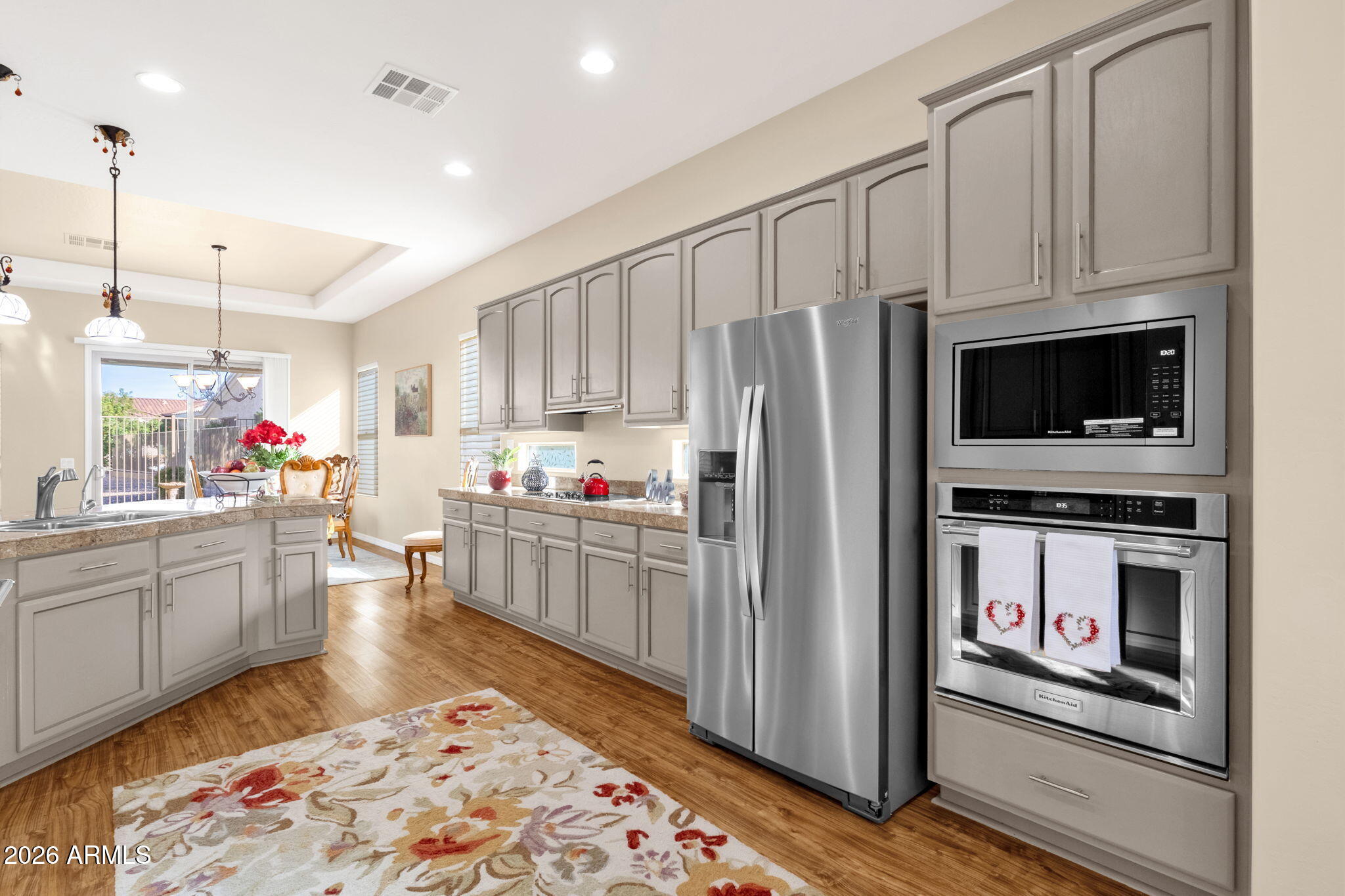 4734 East Indigo Street Gilbert, AZ 85298 - Photo 16 of 32 a kitchen with refrigerator and cabinets