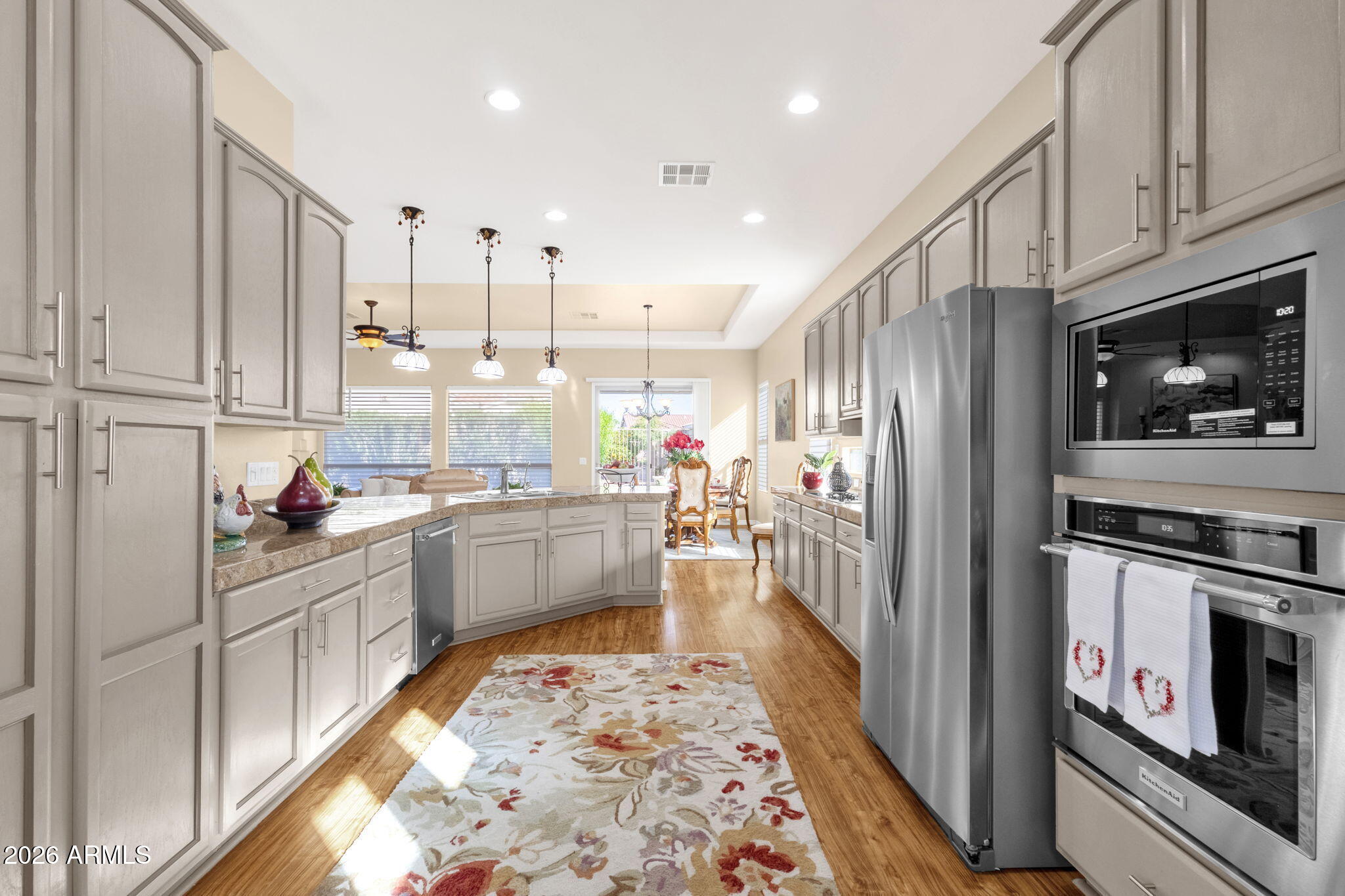 4734 East Indigo Street Gilbert, AZ 85298 - Photo 17 of 32 a kitchen with stainless steel appliances granite countertop a refrigerator stove and sink
