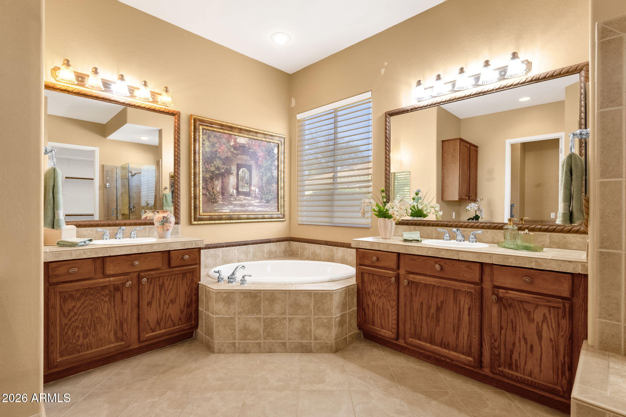 4734 East Indigo Street Gilbert, AZ 85298 - Photo 21 of 32 a spacious bathroom with a tub a double vanity sink and a large mirror