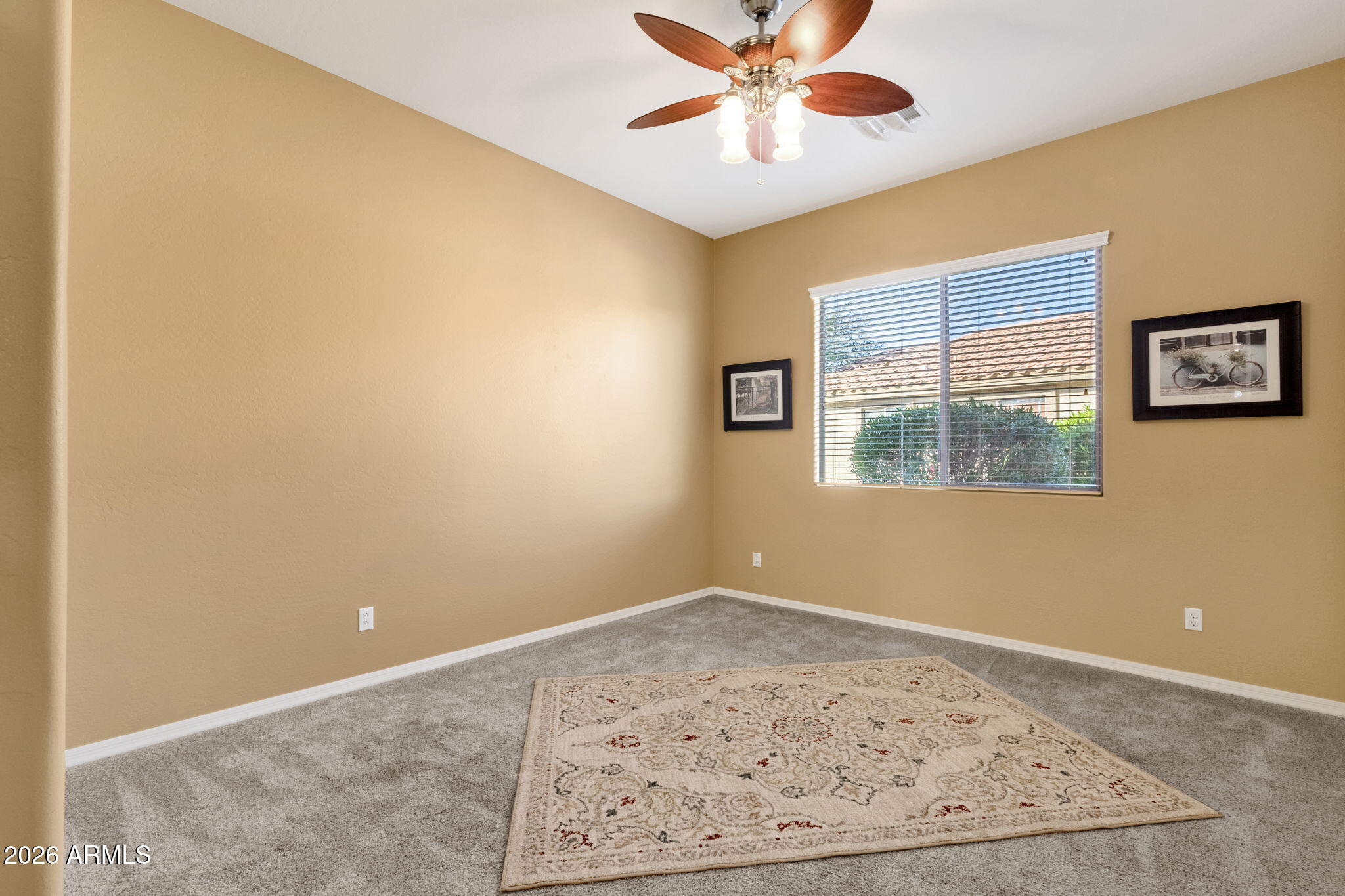 4734 East Indigo Street Gilbert, AZ 85298 - Photo 24 of 32 an empty room with a window and ceiling fan