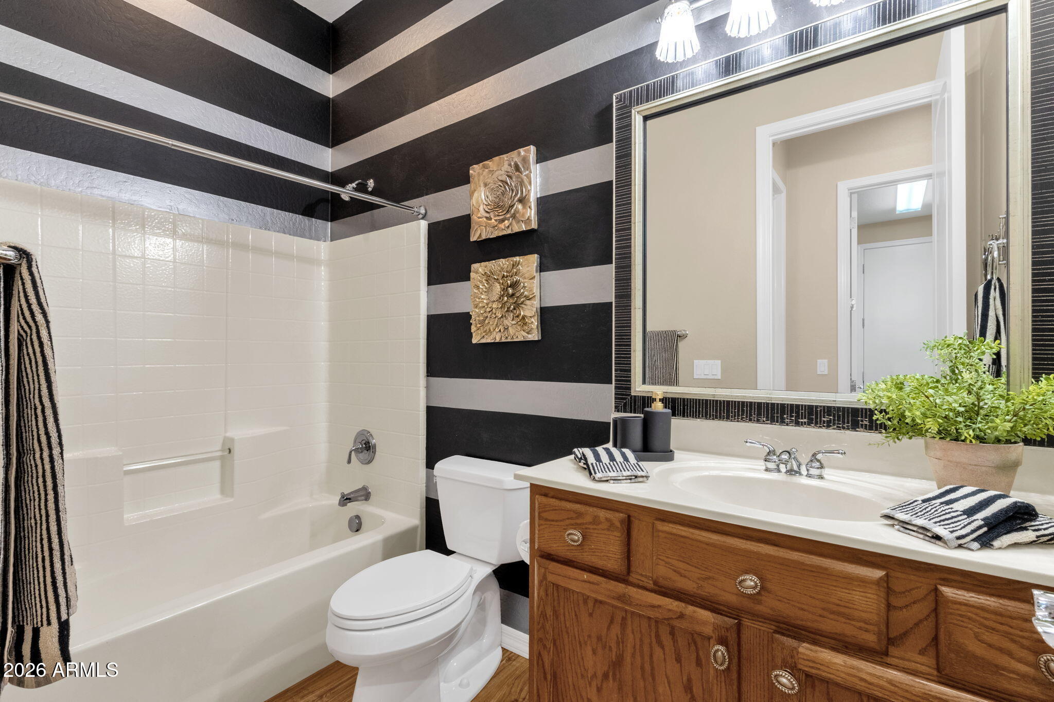 4734 East Indigo Street Gilbert, AZ 85298 - Photo 26 of 32 a bathroom with a sink and a mirror