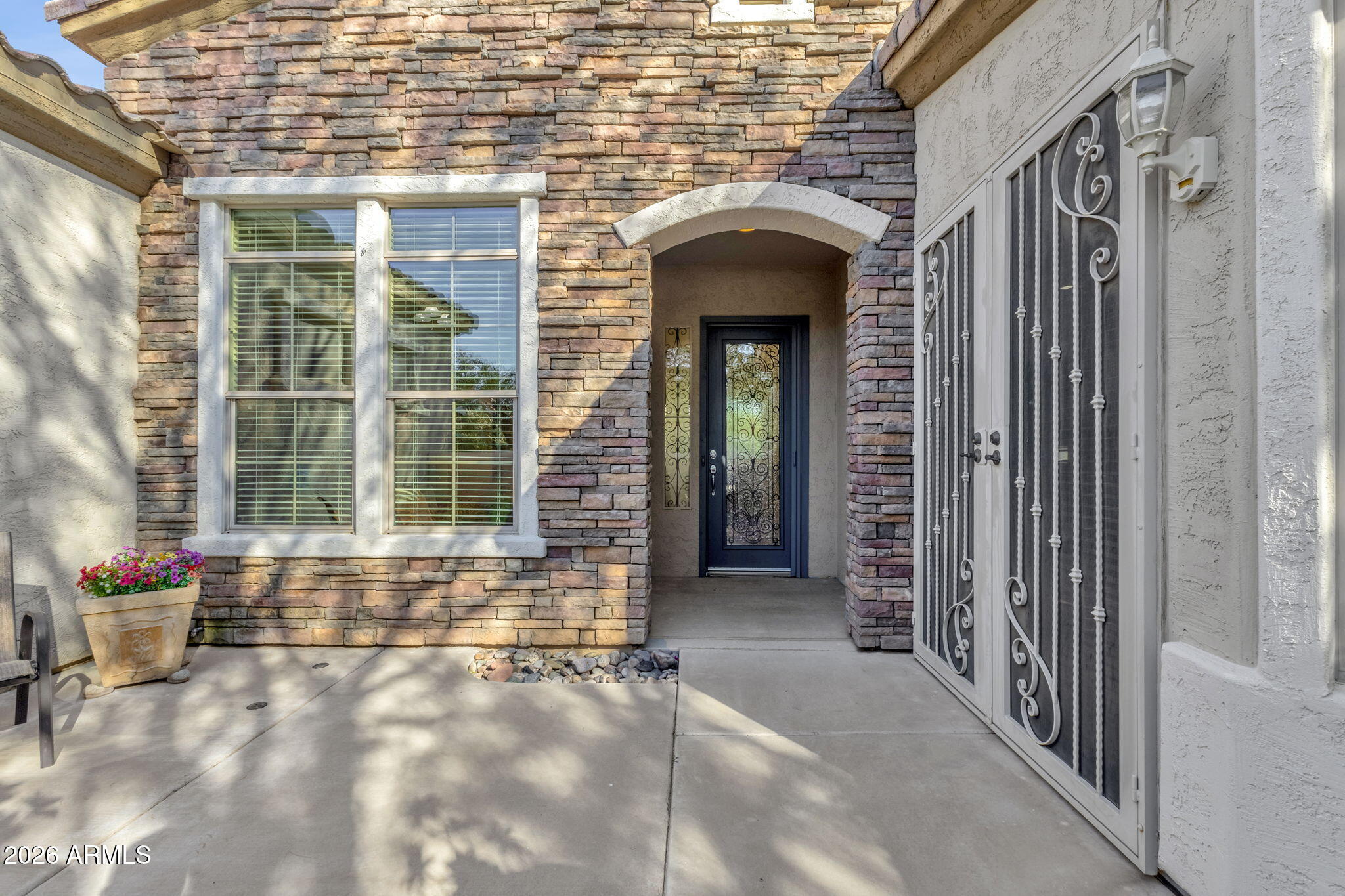 4734 East Indigo Street Gilbert, AZ 85298 - Photo 5 of 32 a front view of a house with outdoor space