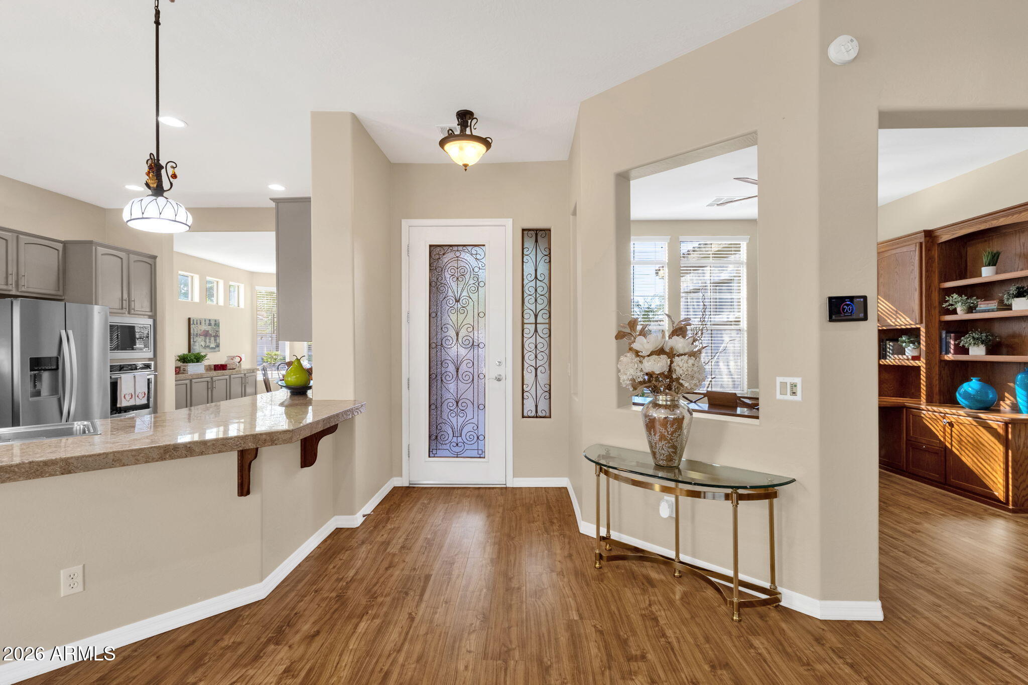 4734 East Indigo Street Gilbert, AZ 85298 - Photo 6 of 32 a living room with furniture and a wooden floor