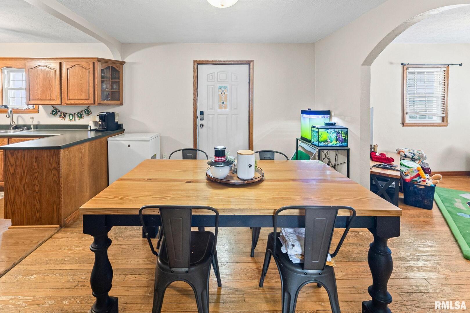 7302 Hoffman Road Centralia, IL 62801 - Photo 14 of 39 a view of a dining room with furniture and wooden floor