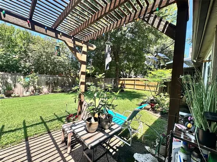 a view of a backyard with wooden floor
