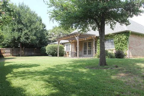 a view of a big yard next to a house