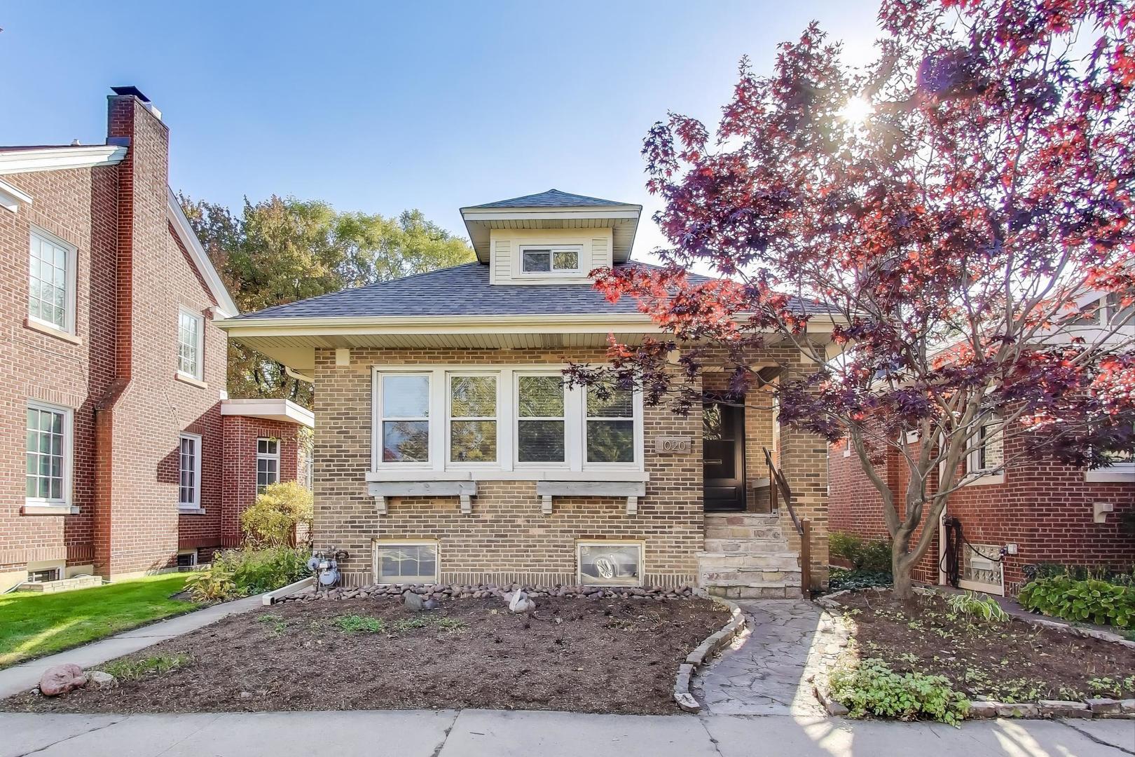 1020 Harvard Terrace Evanston, IL 60202 - Photo 1 of 31 a front view of a house with garden