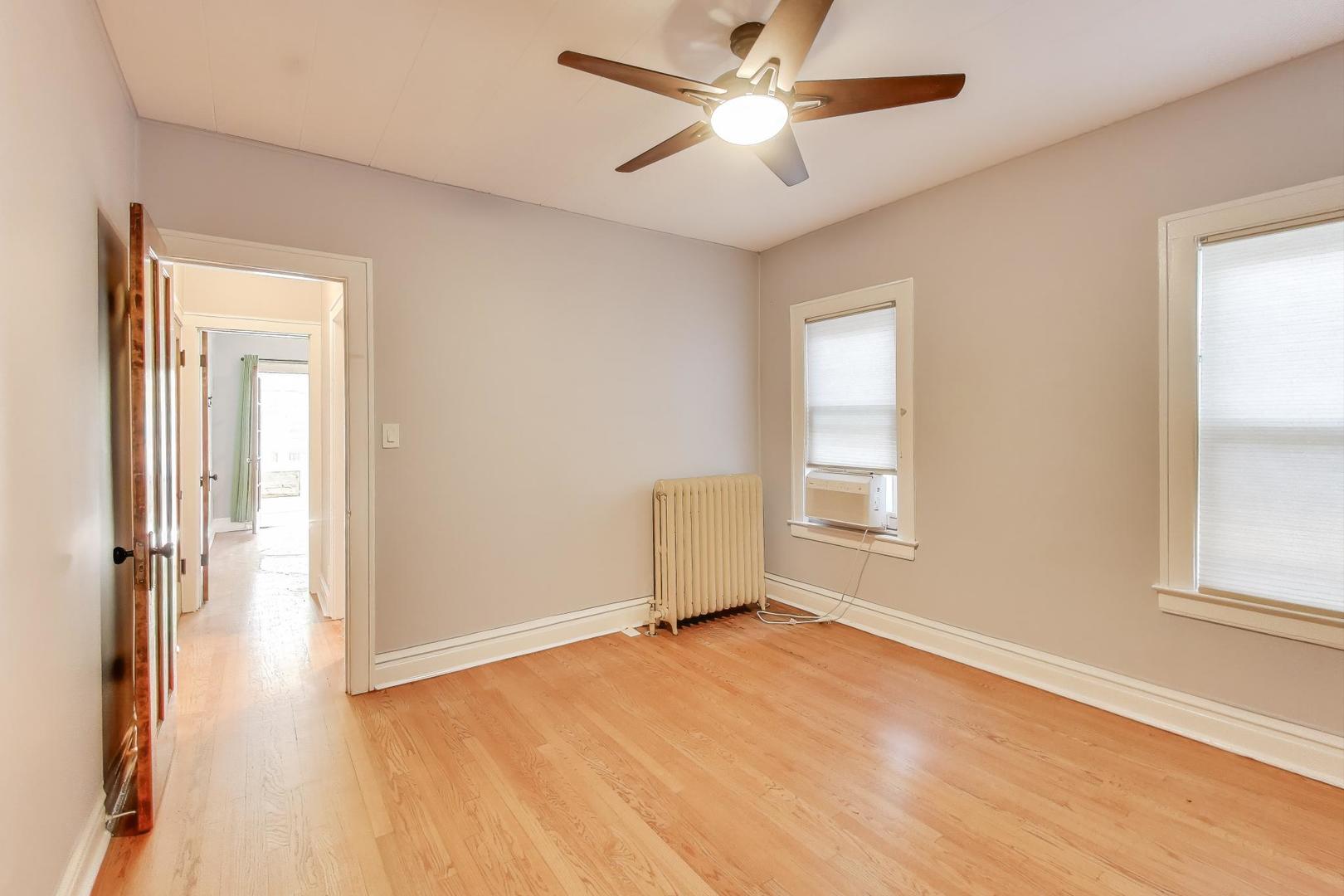 1020 Harvard Terrace Evanston, IL 60202 - Photo 15 of 31 an empty room with windows and fan
