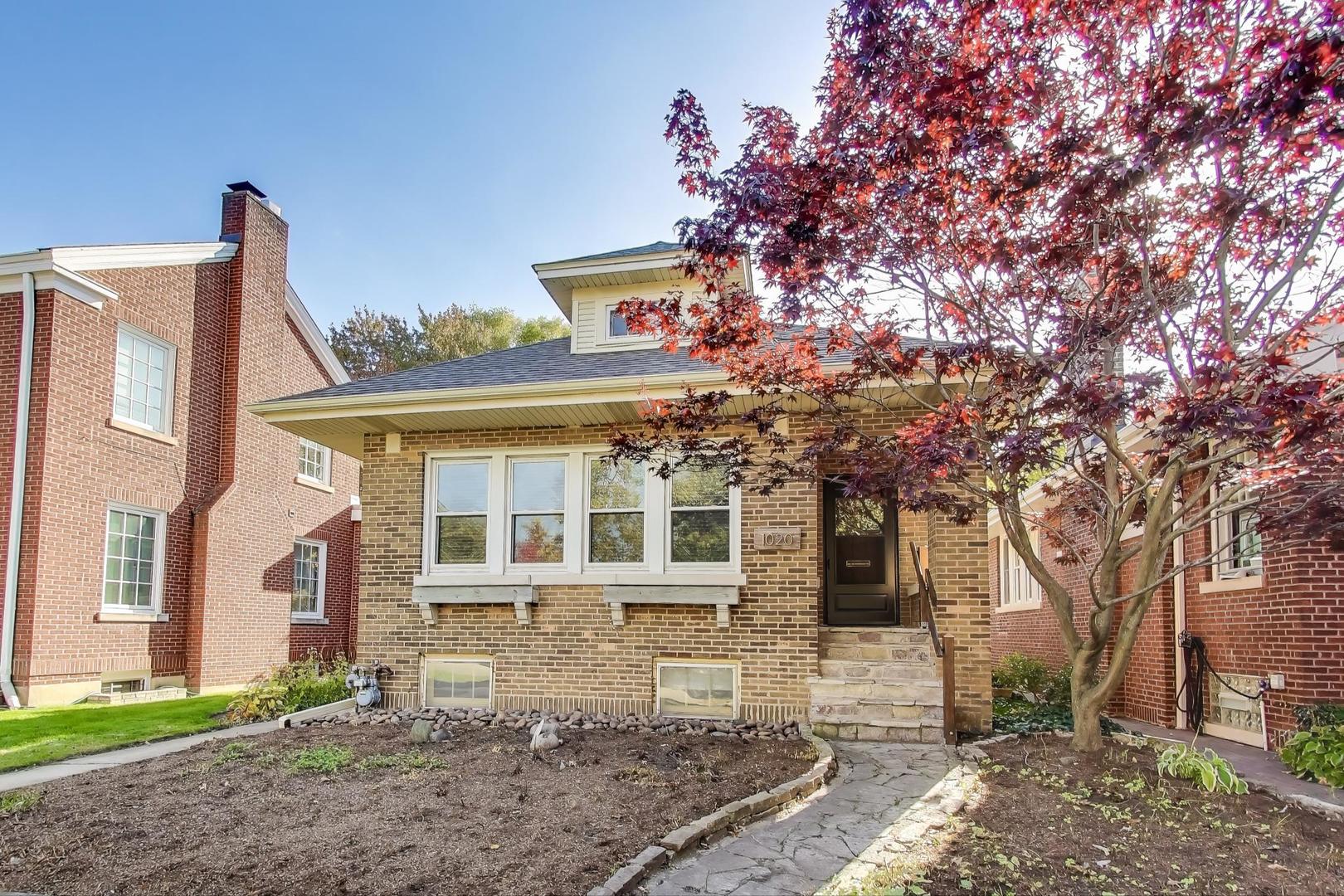 1020 Harvard Terrace Evanston, IL 60202 - Photo 2 of 31 a front view of a house with a yard