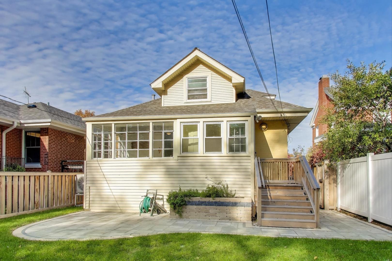 1020 Harvard Terrace Evanston, IL 60202 - Photo 23 of 31 a front view of a house with a yard
