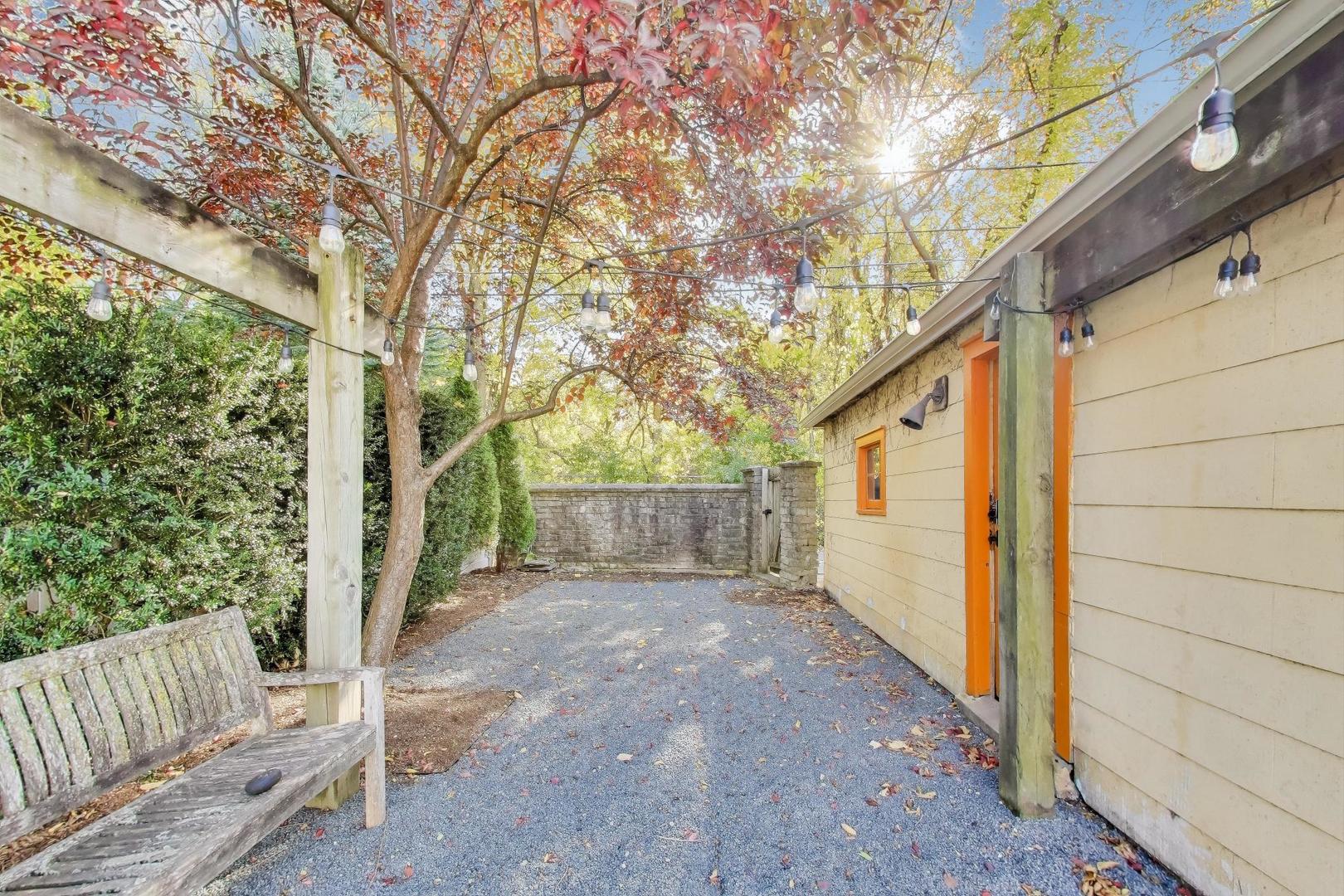 1020 Harvard Terrace Evanston, IL 60202 - Photo 26 of 31 a view of a porch with wooden fence and large trees
