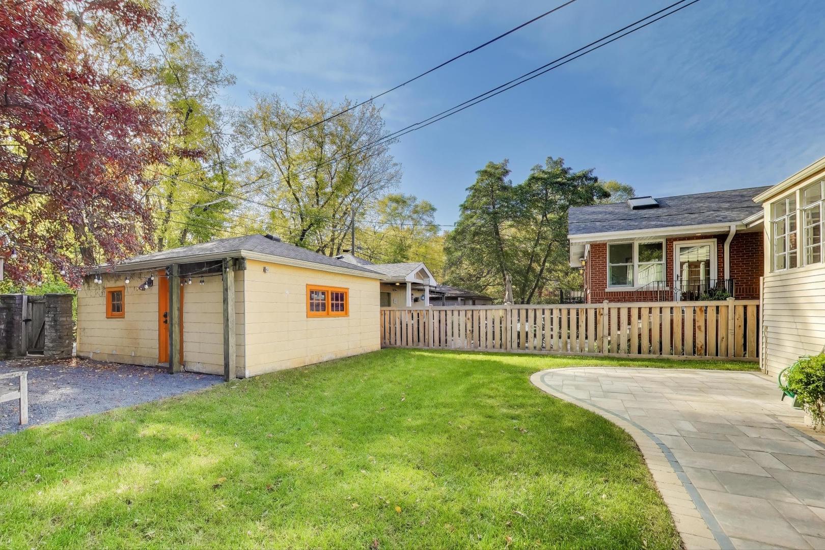 1020 Harvard Terrace Evanston, IL 60202 - Photo 29 of 31 a view of a house with a yard and fence