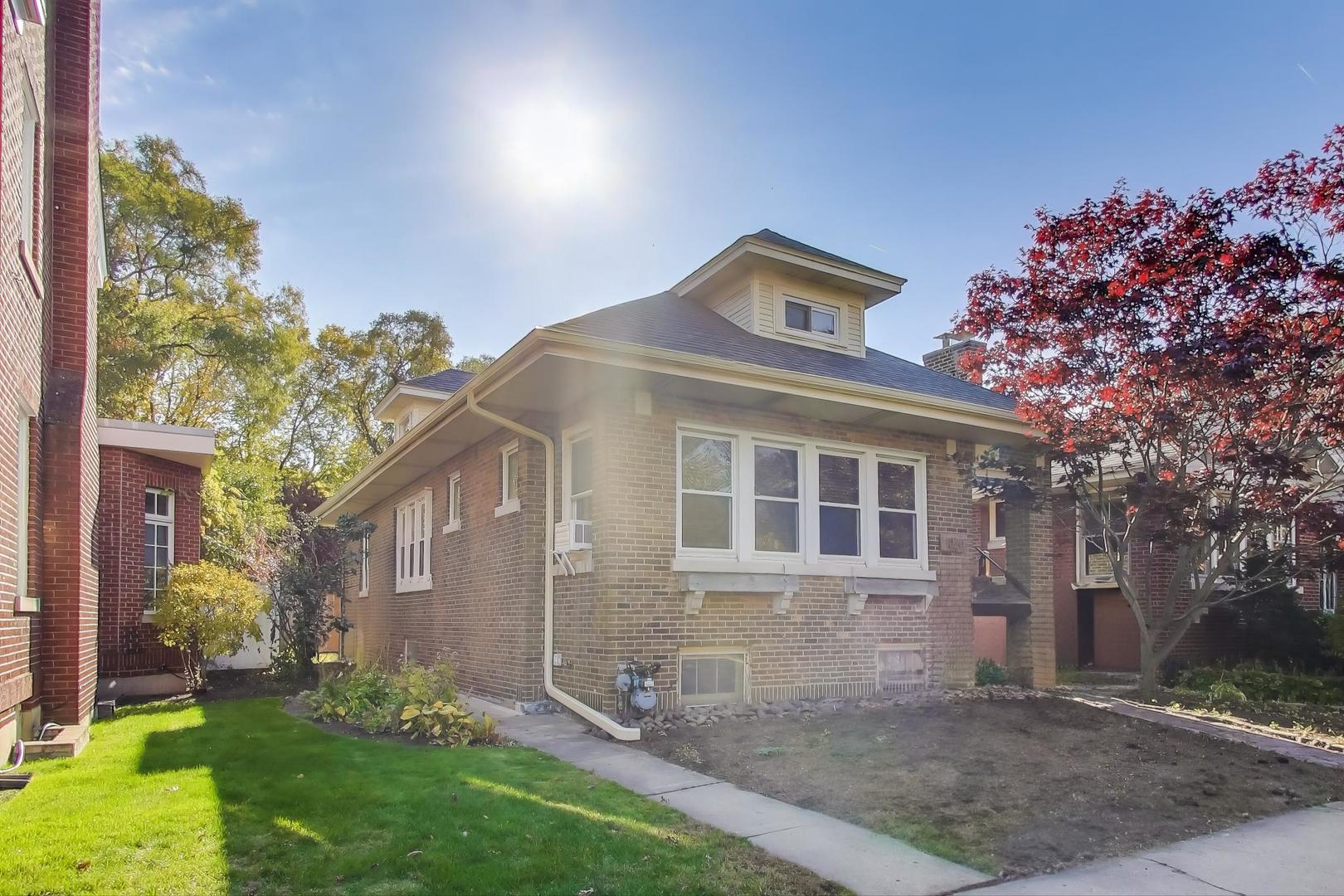 1020 Harvard Terrace Evanston, IL 60202 - Photo 3 of 31 a front view of a house with garden