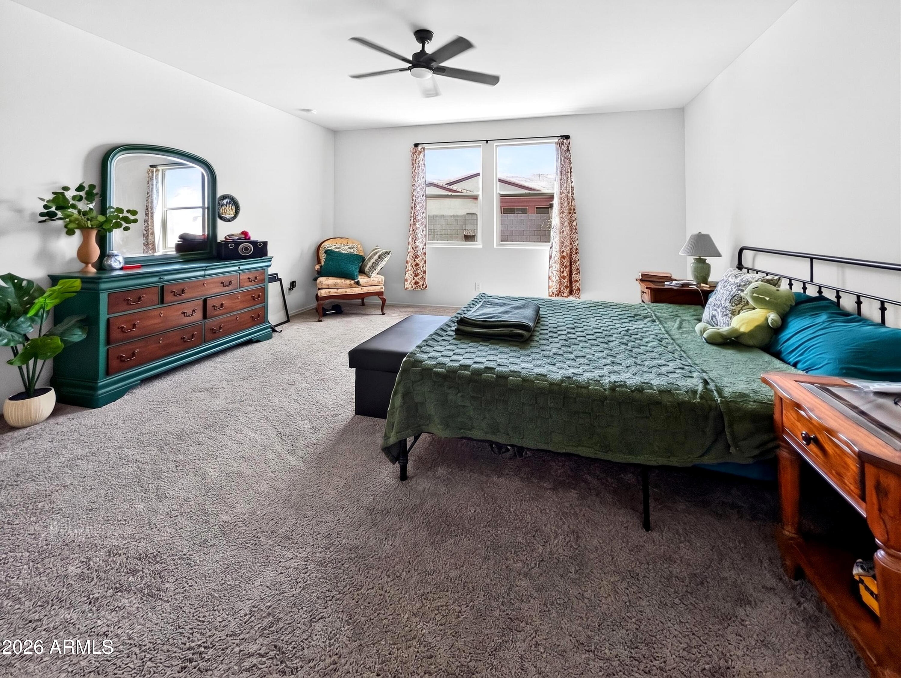 2439 West Pecan Road Phoenix, AZ 85041 - Photo 14 of 38 a bedroom with a bed and a dresser