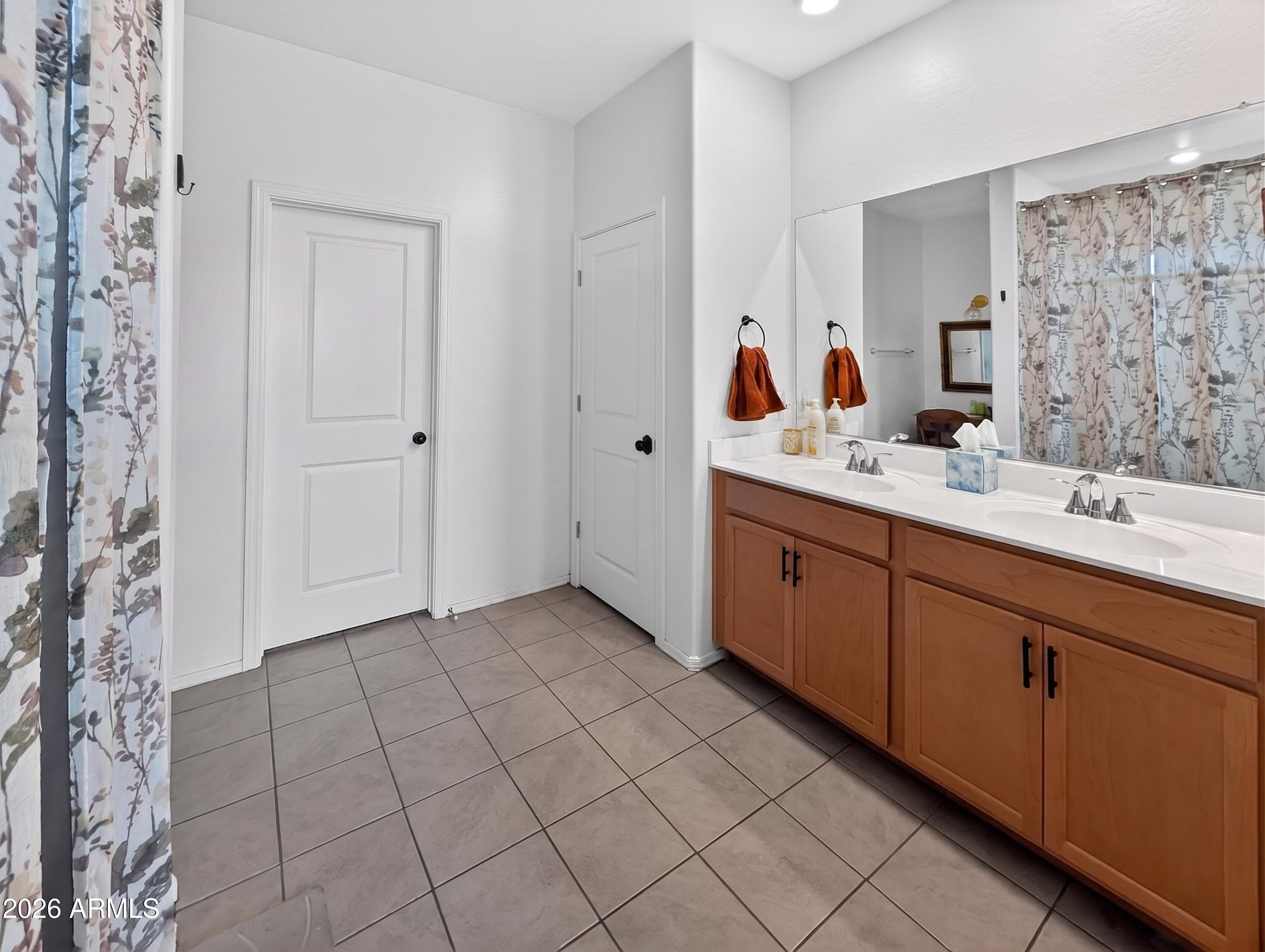 2439 West Pecan Road Phoenix, AZ 85041 - Photo 15 of 38 a spacious bathroom with a double vanity sink mirror and shower