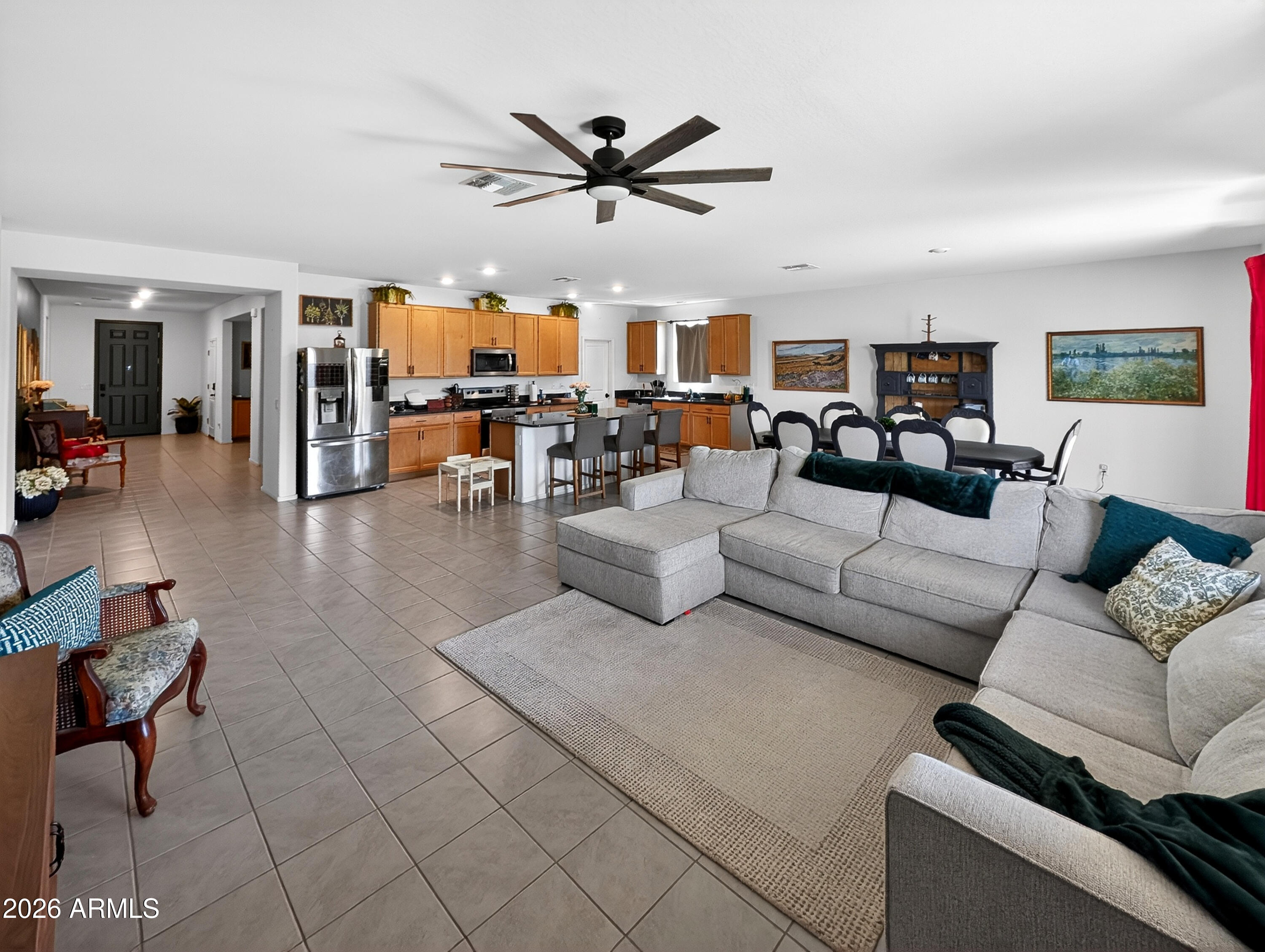 2439 West Pecan Road Phoenix, AZ 85041 - Photo 16 of 38 a living room with furniture and a ceiling fan