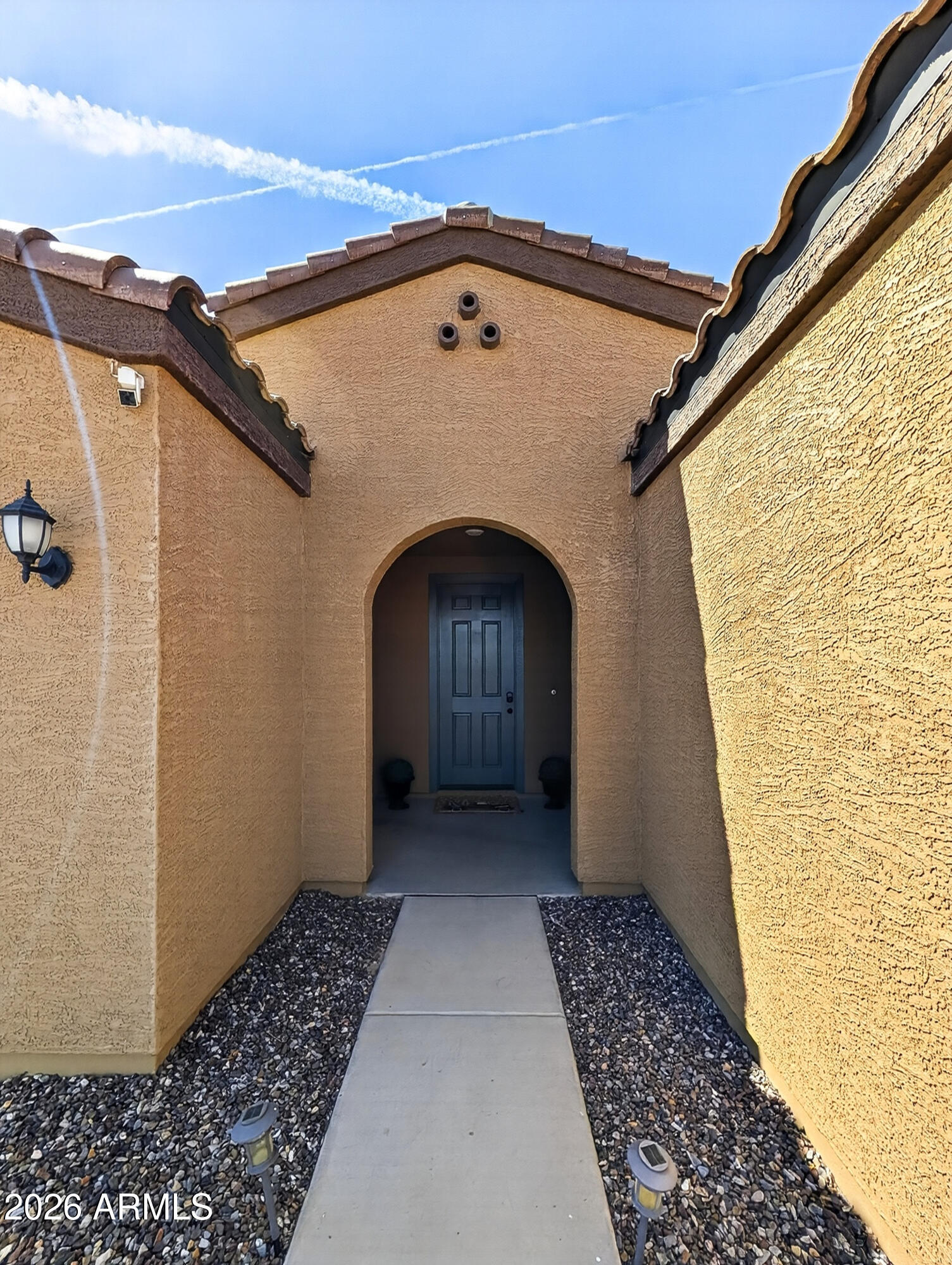 2439 West Pecan Road Phoenix, AZ 85041 - Photo 2 of 38 a front view of a house with a glass door
