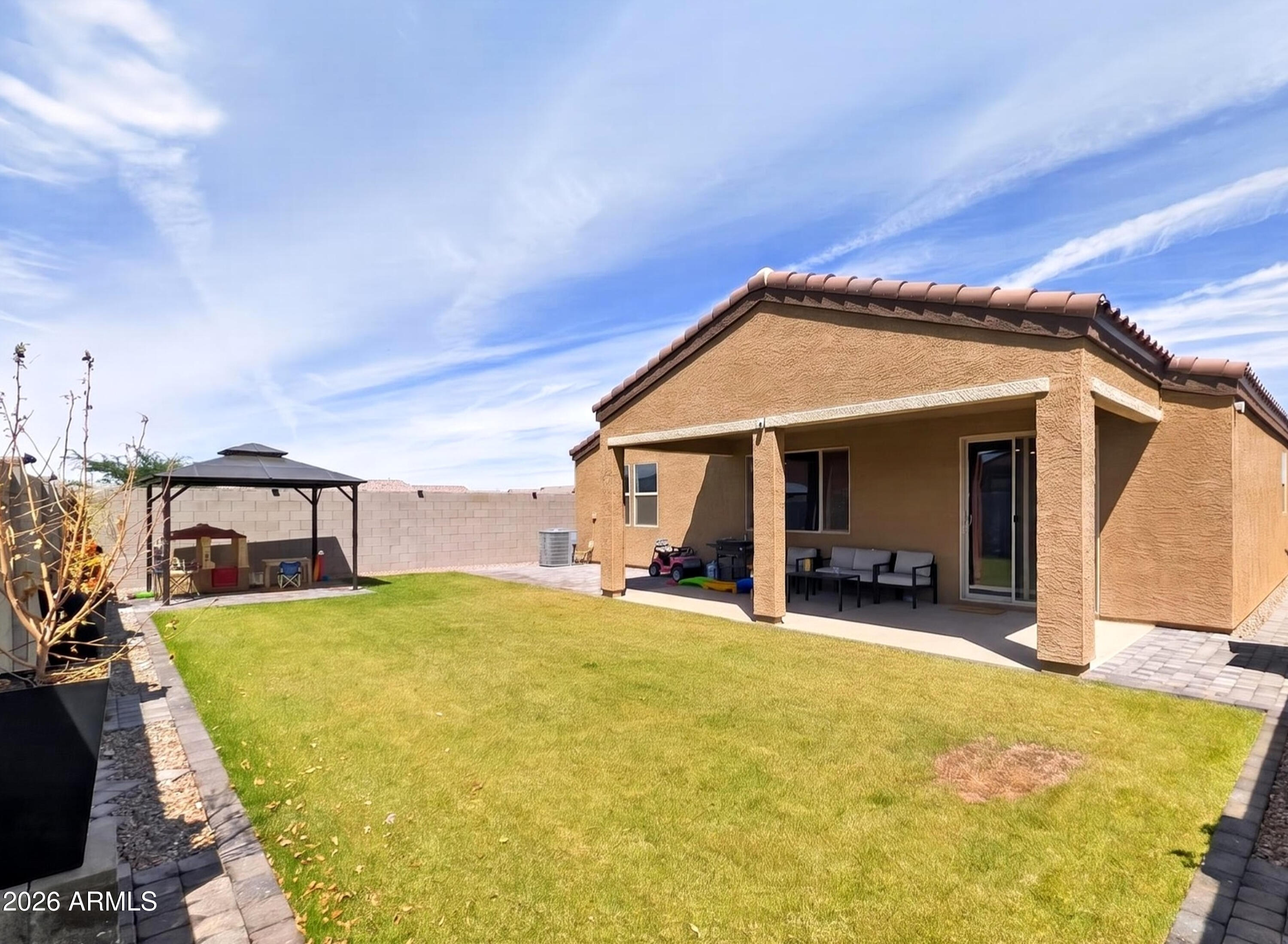 2439 West Pecan Road Phoenix, AZ 85041 - Photo 22 of 38 a view of a house with patio and sitting area