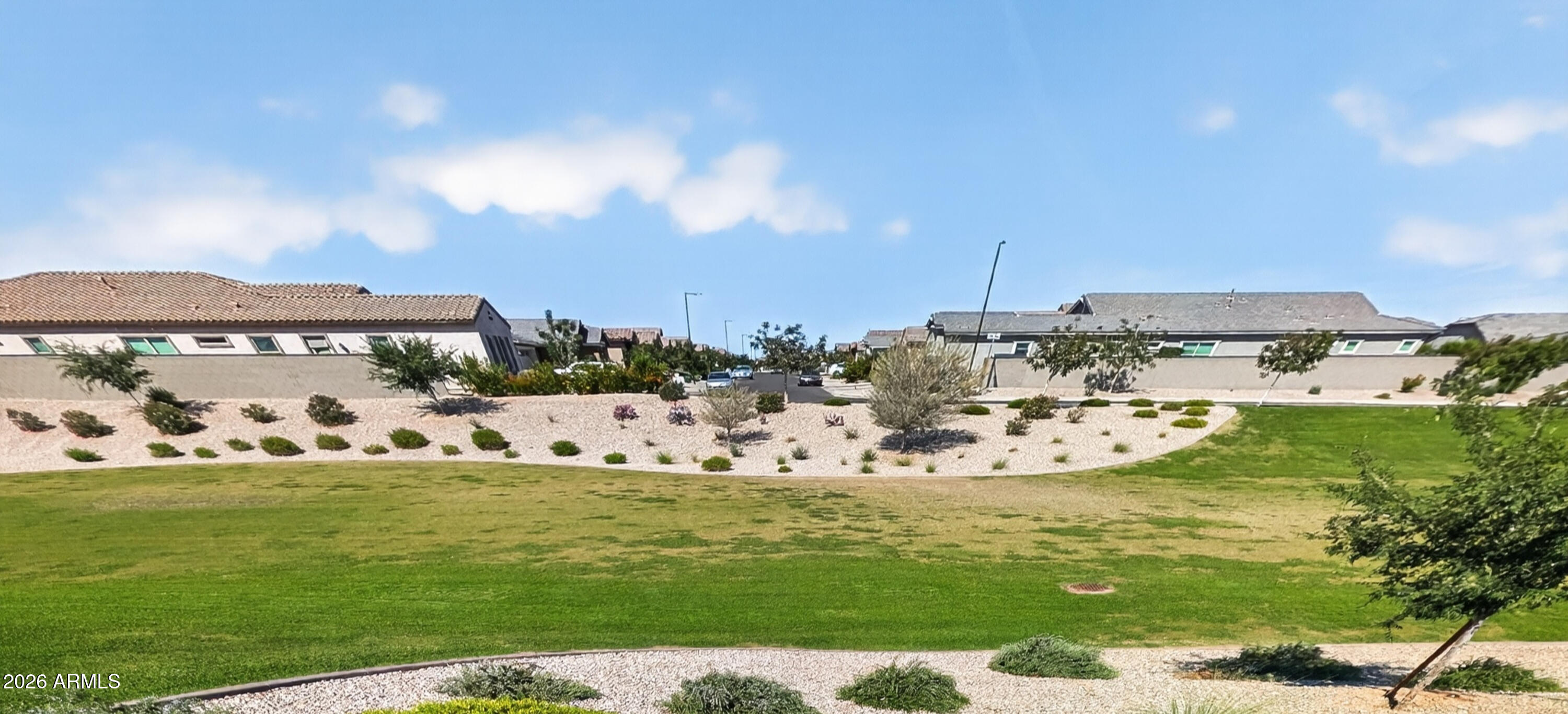 2439 West Pecan Road Phoenix, AZ 85041 - Photo 27 of 38 a view of a lake with houses