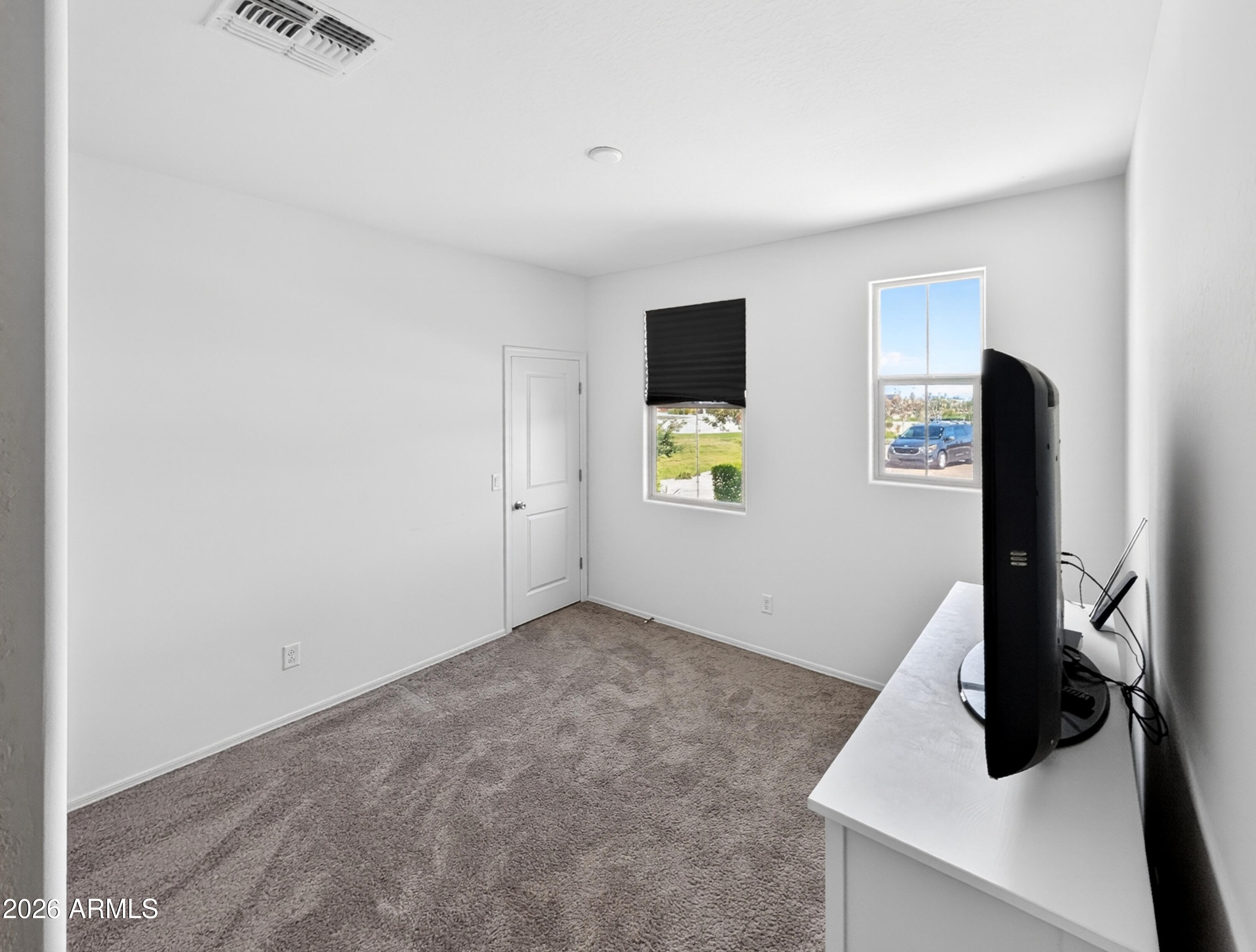 2439 West Pecan Road Phoenix, AZ 85041 - Photo 9 of 38 a view of a livingroom with a flat screen tv