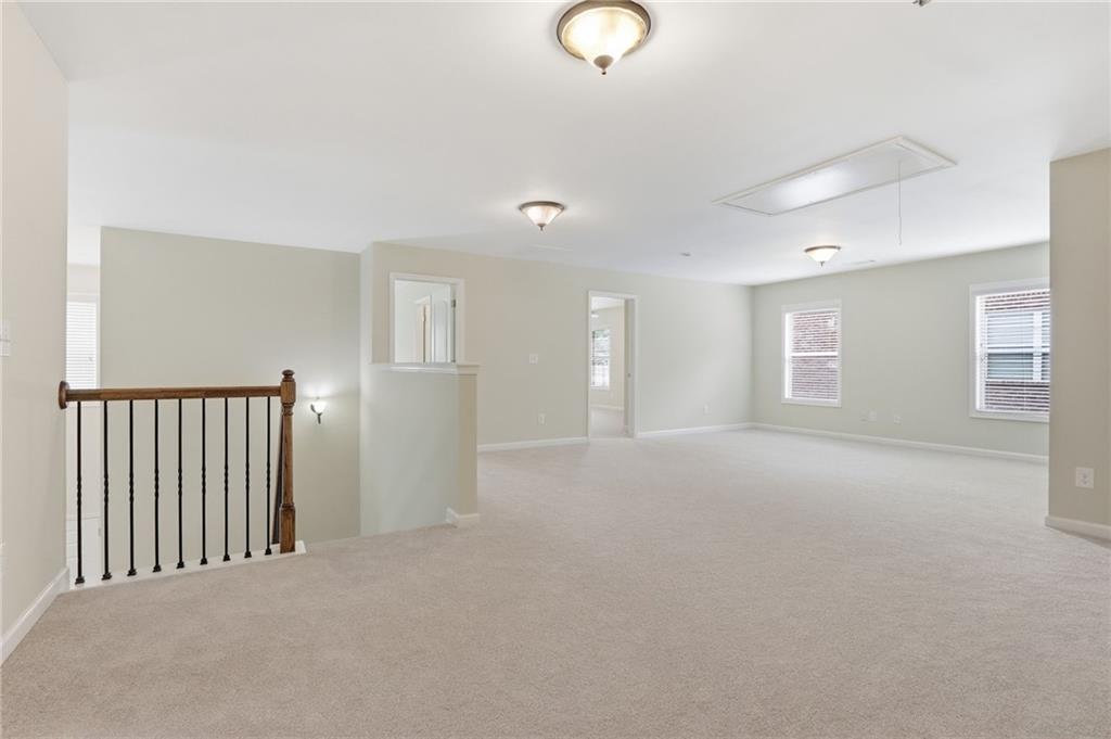 1515 Riva Ridge Suwanee, GA 30024 - Photo 20 of 35 a view of an empty room with a window