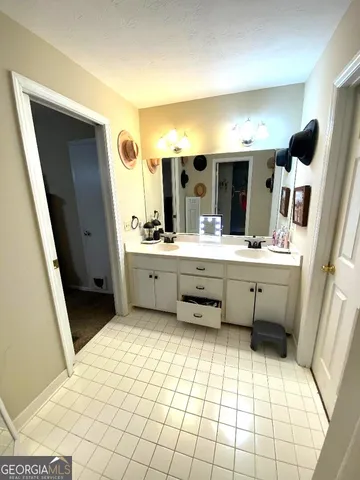 a bathroom with a sink a mirror and a toilet