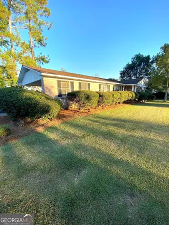 a view of a house with a big yard