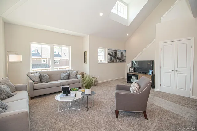 a kitchen with stainless steel appliances kitchen island granite countertop a stove top oven a sink dishwasher a dining table and chairs