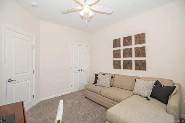a living room with a couch and a window