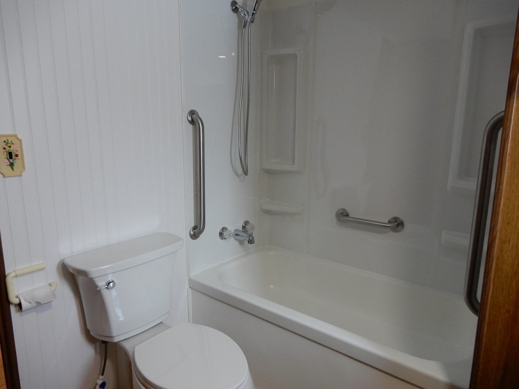 1 Heritage Drive Warren, MA 01585 - Photo 17 of 20 a white bath tub sitting next to a toilet