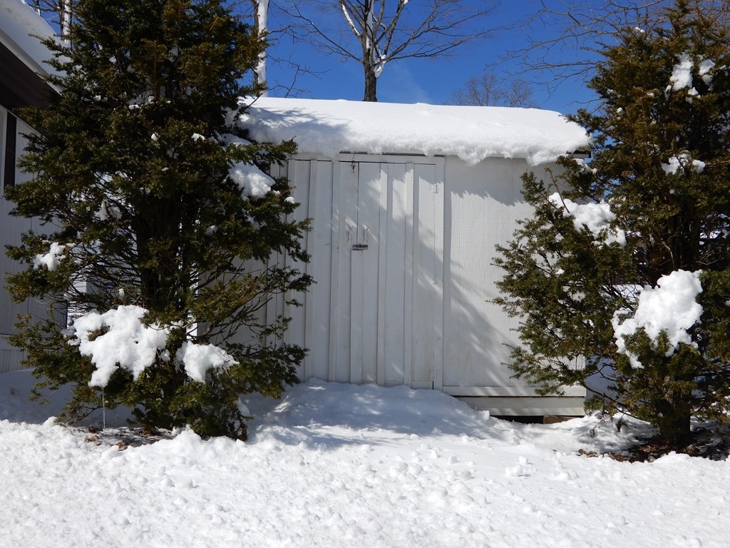 1 Heritage Drive Warren, MA 01585 - Photo 2 of 20 a view of a wooden house with a snow