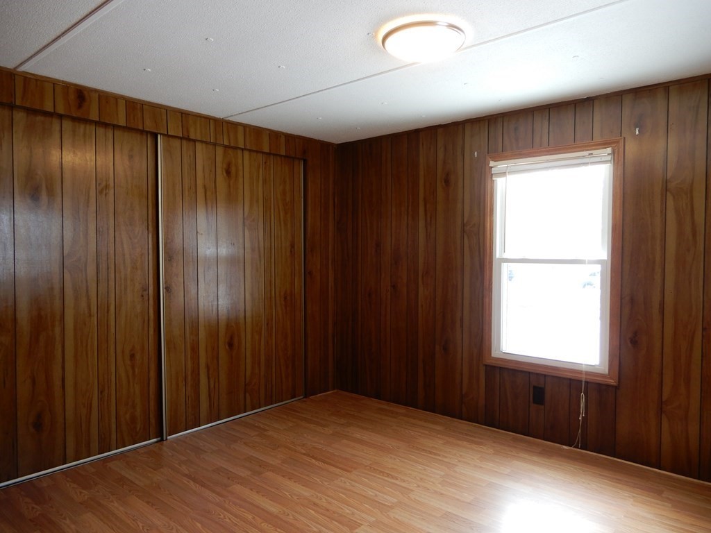 1 Heritage Drive Warren, MA 01585 - Photo 10 of 20 an empty room with windows and closet
