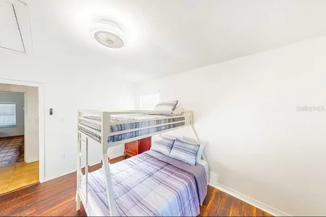 a bedroom with a bed and a view of bathroom