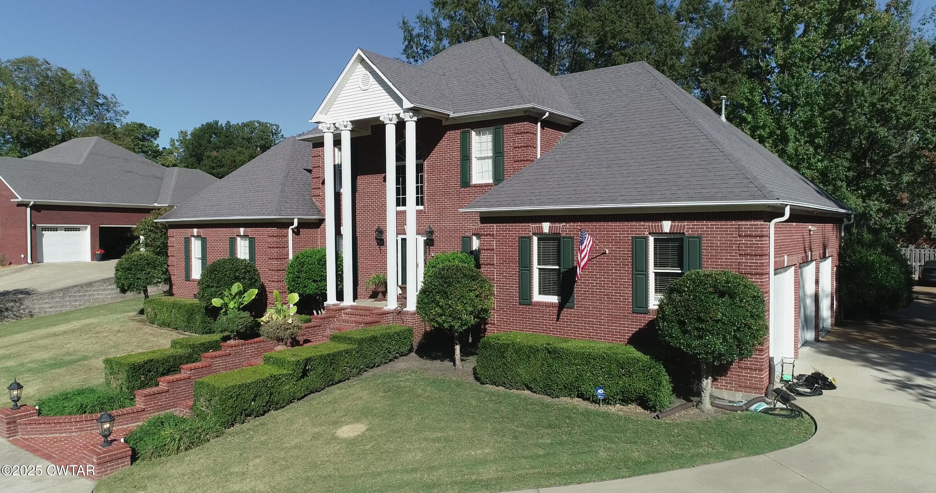 front view of a house with a yard