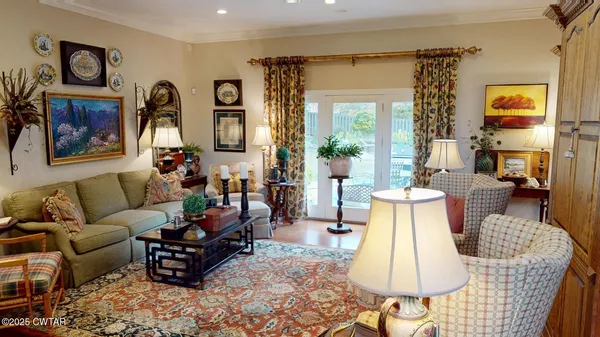 a living room with furniture and a large window