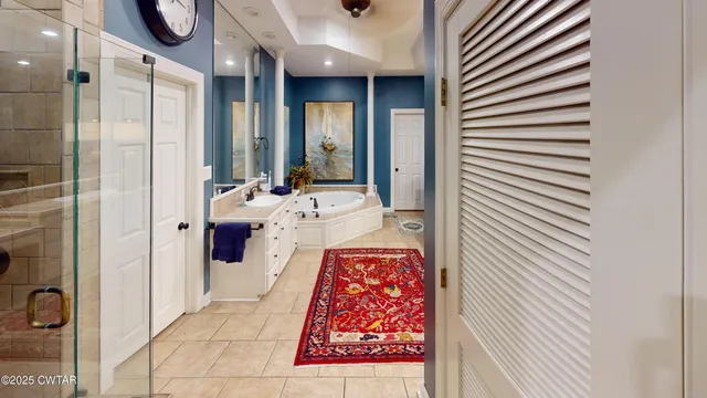 a bathroom with a bathtub and shower