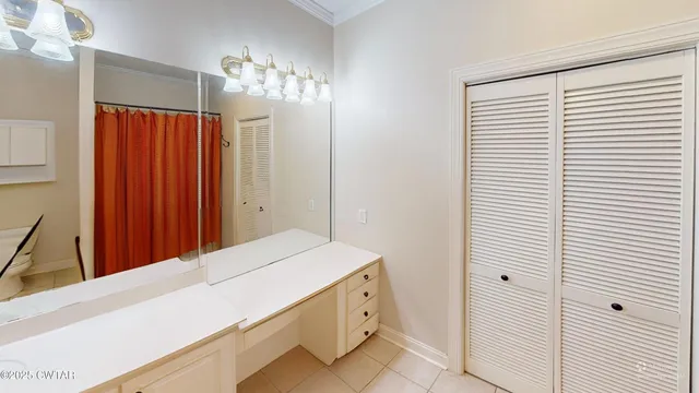 a room with a chandelier and a table