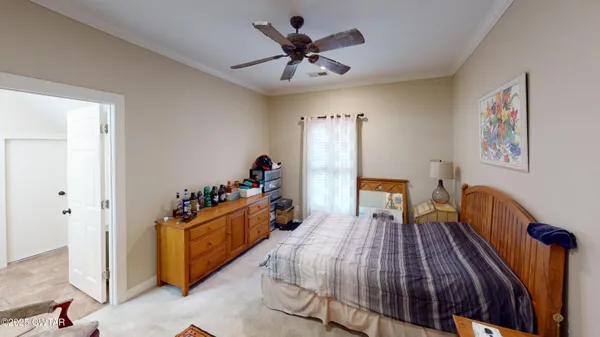 a bed room with a bed and a chandelier