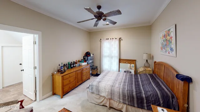 a bed room with a bed and a chandelier