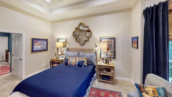 a bed room with a bed and a chair