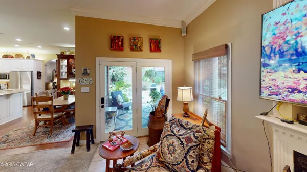 a living room with furniture a rug and a fireplace