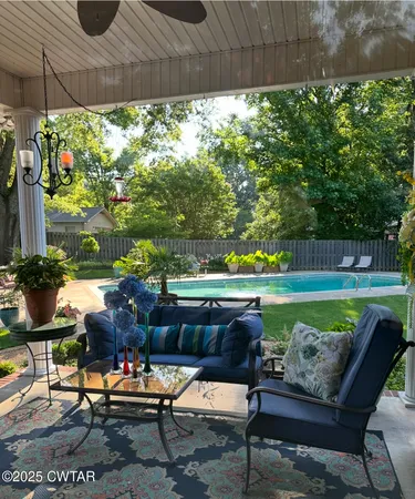 a outdoor living space with furniture and a garden