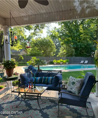 a outdoor living space with furniture and a garden